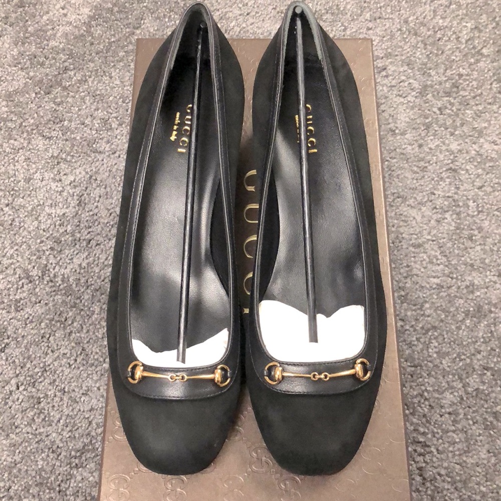 Women’s black suede Gucci horsebit pumps